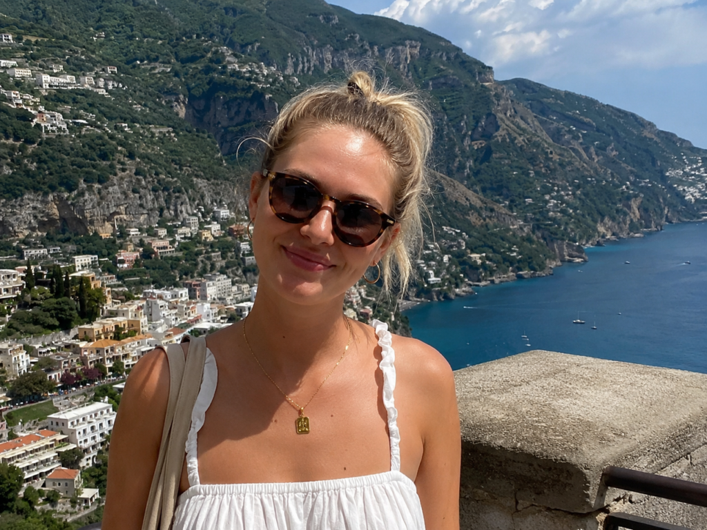 Smiling woman in a travel vlog in Italy, representing the visual context needed before adding music to a video.